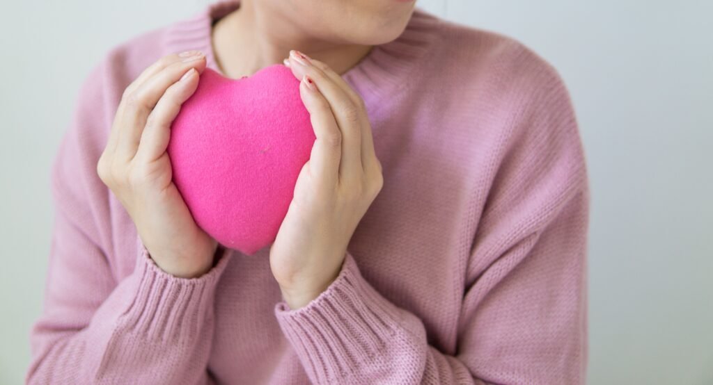 a lady holding heart